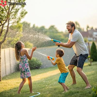 a-father-and-children-playing-with-a-water-gun-tog copy_resized_1749622335.jpg